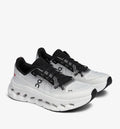 On Cloudtilt Sneakers in white and black with