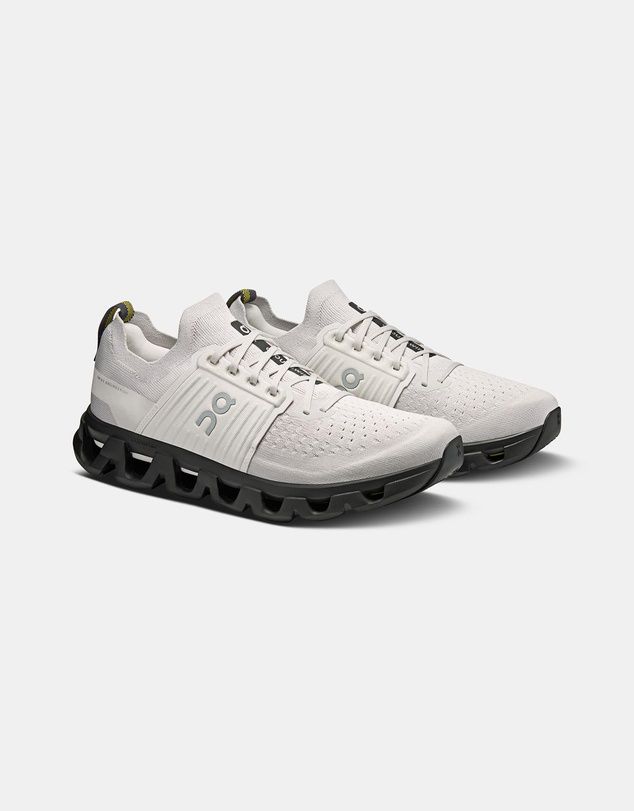 On Cloudswift 4 in white features a sleek, breathable one-piece mesh upper and a distinct bold black CloudTec